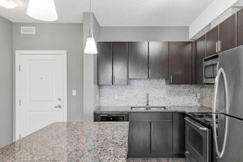 439-23 Millrise Drive Sw, Calgary, AB - Indoor Photo Showing Kitchen With Upgraded Kitchen