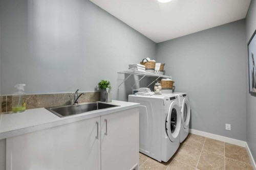 207 Huxland Path Ne, Calgary, AB - Indoor Photo Showing Laundry Room
