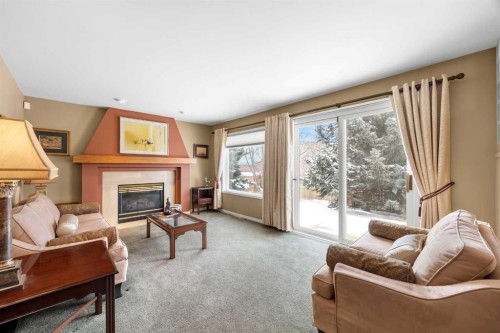 19 Hawkmount Heights Nw, Calgary, AB - Indoor Photo Showing Living Room With Fireplace