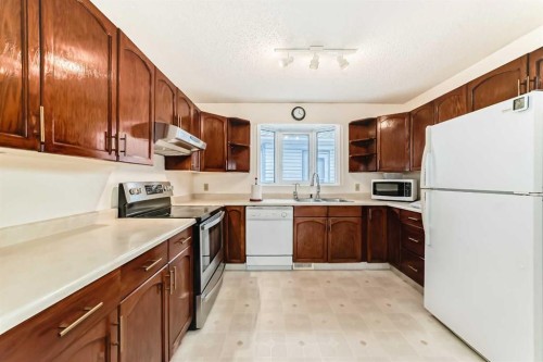 16272 5 Street Sw, Calgary, AB - Indoor Photo Showing Kitchen With Double Sink