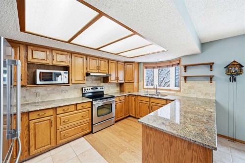 86 Suncanyon Park Se, Calgary, AB - Indoor Photo Showing Kitchen With Double Sink
