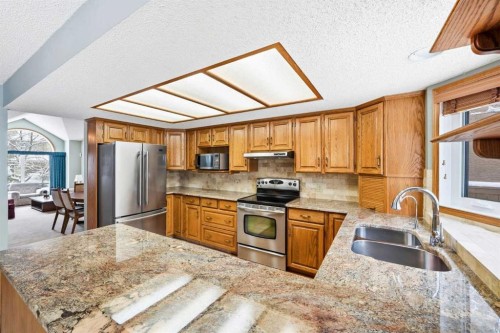 86 Suncanyon Park Se, Calgary, AB - Indoor Photo Showing Kitchen With Double Sink