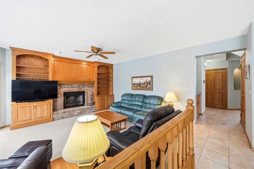 86 Suncanyon Park Se, Calgary, AB - Indoor Photo Showing Living Room With Fireplace
