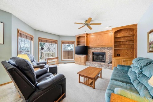 86 Suncanyon Park Se, Calgary, AB - Indoor Photo Showing Living Room With Fireplace