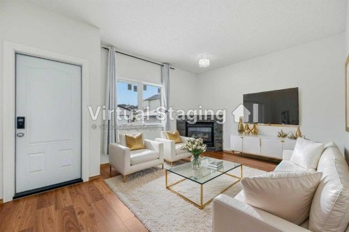 145 Covebrook Close Ne, Calgary, AB - Indoor Photo Showing Living Room With Fireplace
