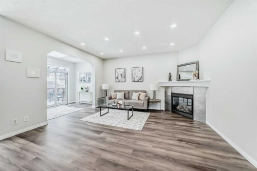 21 Panamount Row Nw, Calgary, AB - Indoor Photo Showing Living Room With Fireplace