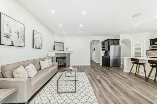 21 Panamount Row Nw, Calgary, AB - Indoor Photo Showing Other Room With Fireplace