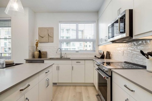 1469 Na'A Drive Sw, Calgary, AB - Indoor Photo Showing Kitchen