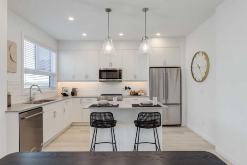1469 Na'A Drive Sw, Calgary, AB - Indoor Photo Showing Kitchen With Stainless Steel Kitchen With Double Sink With Upgraded Kitchen