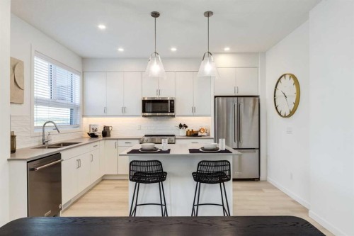 1469 Na'A Drive Sw, Calgary, AB - Indoor Photo Showing Kitchen With Stainless Steel Kitchen With Double Sink With Upgraded Kitchen