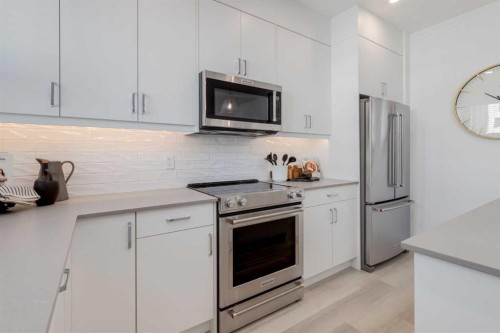 1469 Na'A Drive Sw, Calgary, AB - Indoor Photo Showing Kitchen With Stainless Steel Kitchen With Upgraded Kitchen