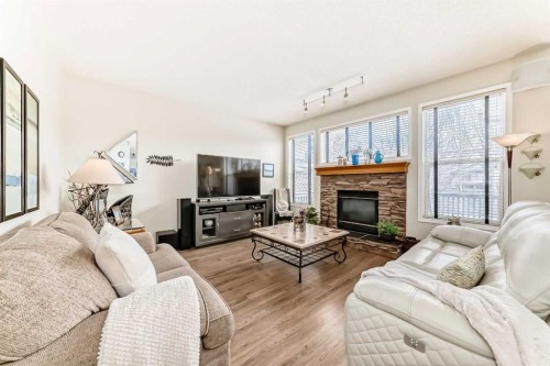 42 Somerset Circle Sw, Calgary, AB - Indoor Photo Showing Living Room With Fireplace