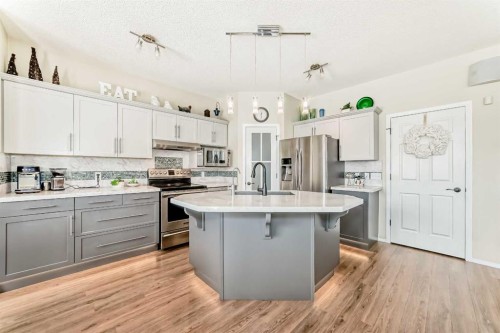 42 Somerset Circle Sw, Calgary, AB - Indoor Photo Showing Kitchen With Stainless Steel Kitchen With Upgraded Kitchen
