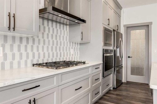 142 Cranbrook Park Se, Calgary, AB - Indoor Photo Showing Kitchen With Upgraded Kitchen