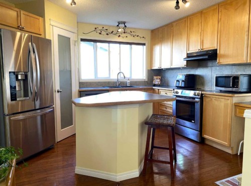 90 Tuscany Springs Heights Nw, Calgary, AB - Indoor Photo Showing Kitchen With Stainless Steel Kitchen