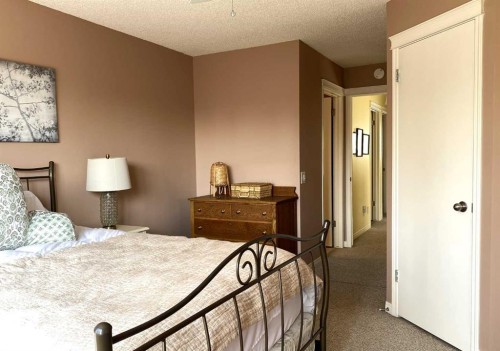90 Tuscany Springs Heights Nw, Calgary, AB - Indoor Photo Showing Bedroom