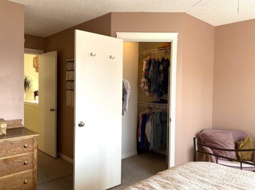 90 Tuscany Springs Heights Nw, Calgary, AB - Indoor Photo Showing Bedroom