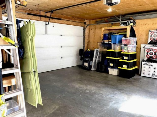 90 Tuscany Springs Heights Nw, Calgary, AB - Indoor Photo Showing Garage