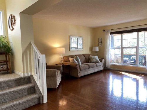 90 Tuscany Springs Heights Nw, Calgary, AB - Indoor Photo Showing Living Room