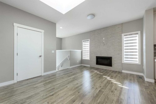 35 Sherview Grove Nw, Calgary, AB - Indoor Photo Showing Other Room With Fireplace