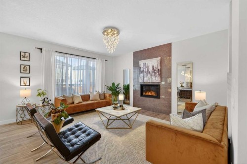113 Sandpiper Bay, Chestermere, AB - Indoor Photo Showing Living Room With Fireplace