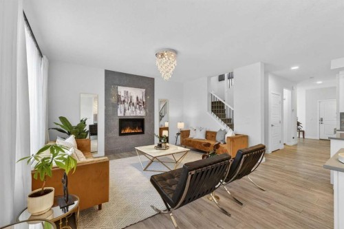 113 Sandpiper Bay, Chestermere, AB - Indoor Photo Showing Living Room With Fireplace