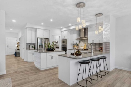 113 Sandpiper Bay, Chestermere, AB - Indoor Photo Showing Kitchen With Upgraded Kitchen