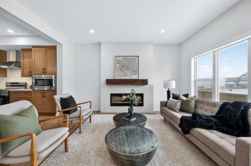 36 Lewiston Common Ne, Calgary, AB - Indoor Photo Showing Living Room With Fireplace
