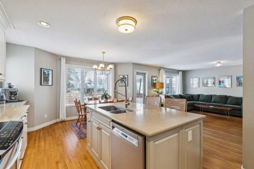 107 Sheep River Bay, Okotoks, AB - Indoor Photo Showing Kitchen With Double Sink