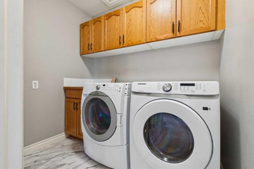 107 Sheep River Bay, Okotoks, AB - Indoor Photo Showing Laundry Room