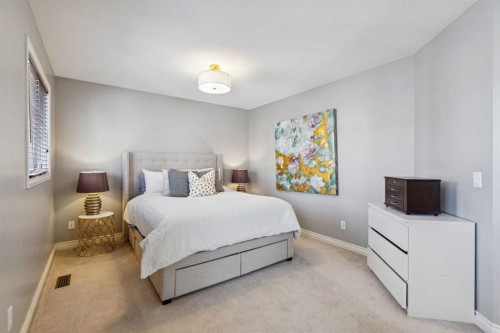 107 Sheep River Bay, Okotoks, AB - Indoor Photo Showing Bedroom