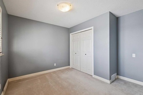 107 Sheep River Bay, Okotoks, AB - Indoor Photo Showing Other Room