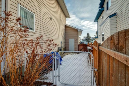 107 Sheep River Bay, Okotoks, AB - Outdoor With Exterior