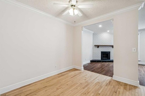 131 Woodglen Way Sw, Calgary, AB - Indoor With Fireplace