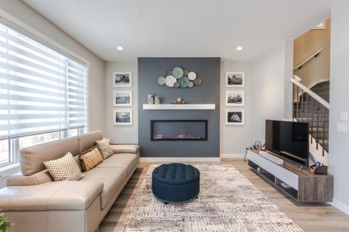 301 Crestmont Drive Sw, Calgary, AB - Indoor Photo Showing Living Room With Fireplace