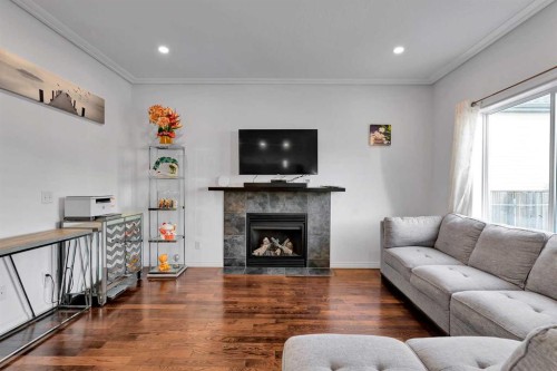 175 Evansmeade Common Nw, Calgary, AB - Indoor Photo Showing Living Room With Fireplace