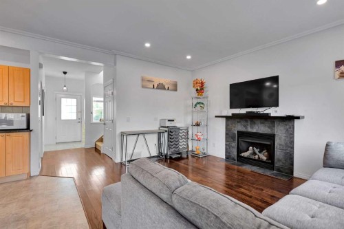 175 Evansmeade Common Nw, Calgary, AB - Indoor Photo Showing Living Room With Fireplace