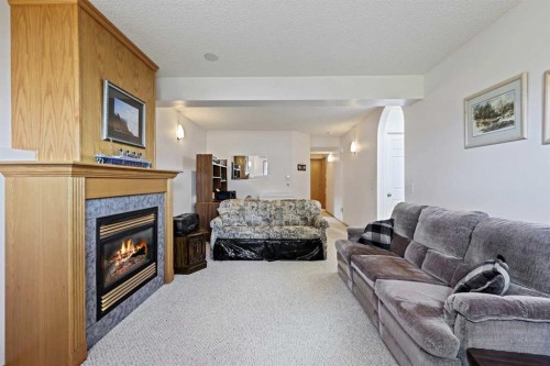 272 Saddlemead Road Ne, Calgary, AB - Indoor Photo Showing Living Room With Fireplace