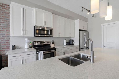 237 Mckenzie Towne Link Se, Calgary, AB - Indoor Photo Showing Kitchen With Stainless Steel Kitchen With Double Sink With Upgraded Kitchen