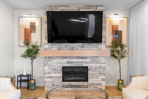 1104 Cranbrook Gardens Se, Calgary, AB - Indoor Photo Showing Living Room With Fireplace