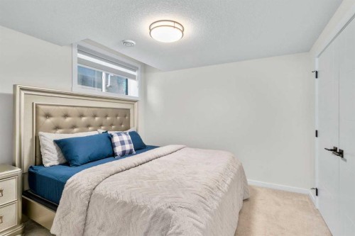 1104 Cranbrook Gardens Se, Calgary, AB - Indoor Photo Showing Bedroom
