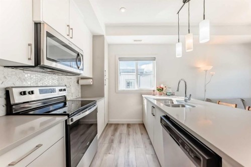 123 Spring Creek Common Sw, Calgary, AB - Indoor Photo Showing Kitchen With Stainless Steel Kitchen With Double Sink With Upgraded Kitchen