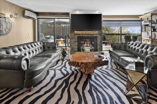 302-320 Meredith Road Ne, Calgary, AB - Indoor Photo Showing Living Room With Fireplace