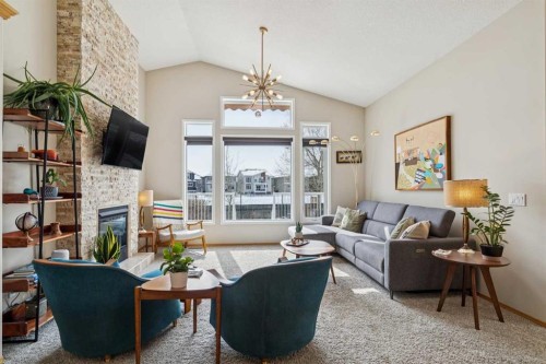 113 Westchester Way, Chestermere, AB - Indoor Photo Showing Living Room With Fireplace
