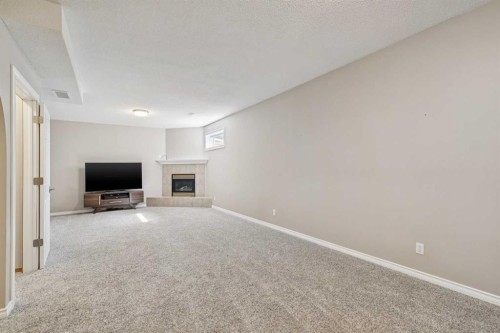 113 Westchester Way, Chestermere, AB - Indoor Photo Showing Other Room With Fireplace