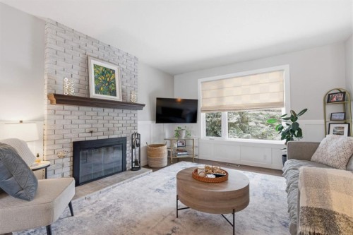 8411 Silver Springs Road Nw, Calgary, AB - Indoor Photo Showing Living Room With Fireplace