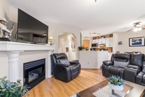 158 Saratoga Close Ne, Calgary, AB - Indoor Photo Showing Living Room With Fireplace