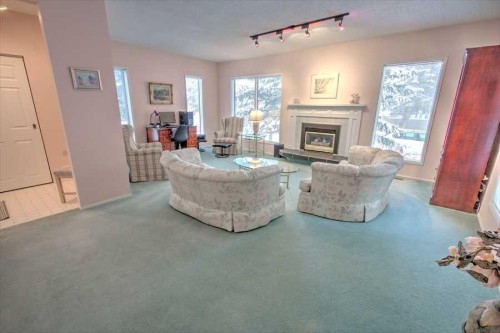 6719 Coach Hill Road Sw, Calgary, AB - Indoor Photo Showing Living Room With Fireplace