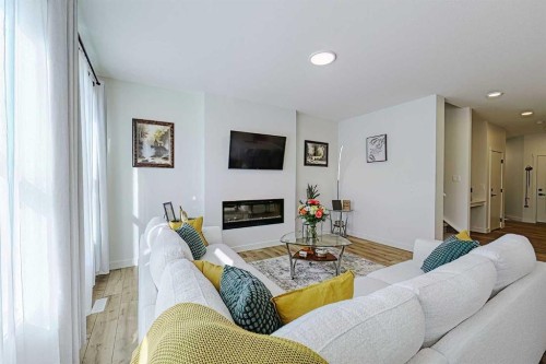25 Belmont Green Sw, Calgary, AB - Indoor Photo Showing Living Room With Fireplace