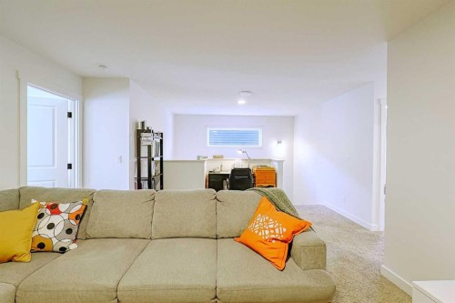 25 Belmont Green Sw, Calgary, AB - Indoor Photo Showing Living Room
